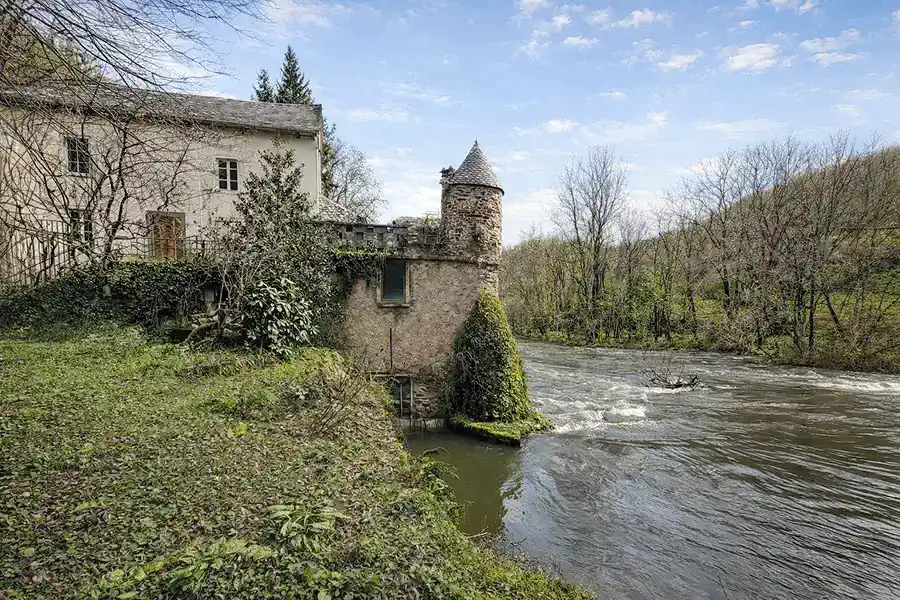 Historic mill at the lake in Southern France