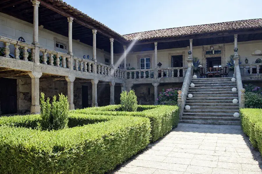 The granite exterior and U-shaped layout of the historic Galician manor house