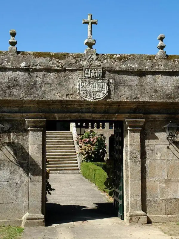 The main granite gateway leading into the central courtyard of Pazo de Ferreiroá.